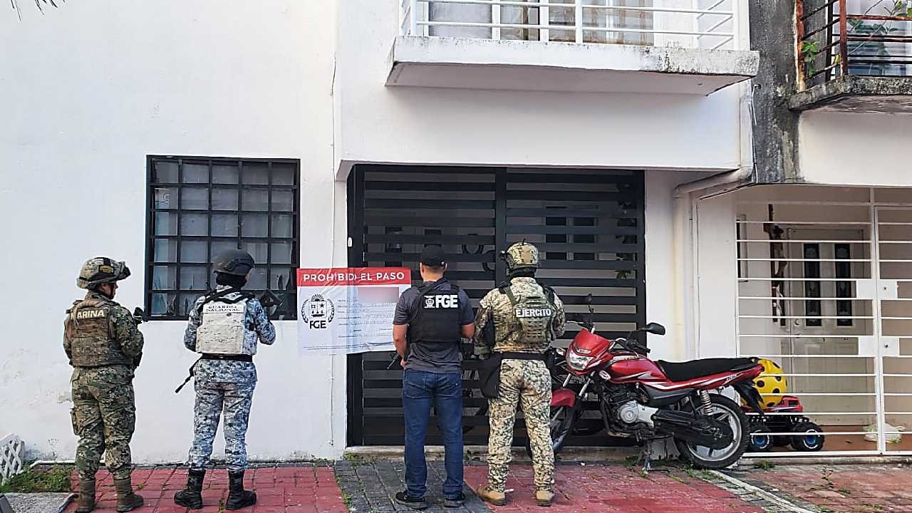 Evidence including drugs and surveillance equipment displayed after raids in Quintana Roo