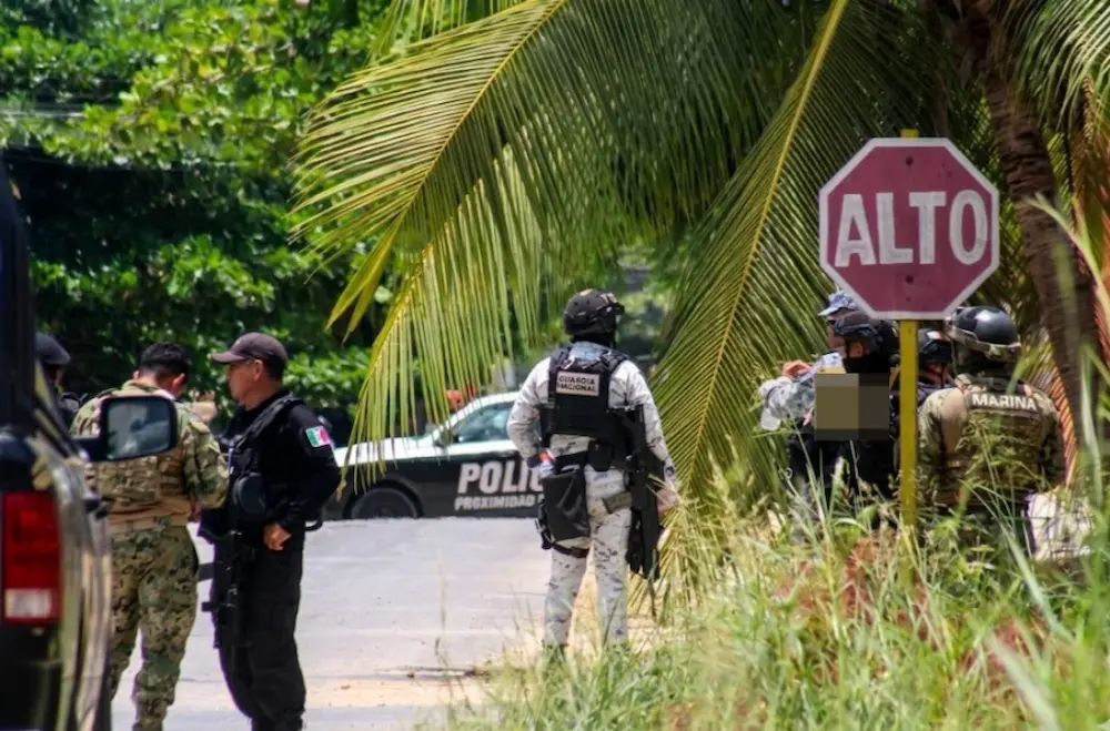 Assault rifles and a grenade launcher seized by Mexican security forces in Felipe Carrillo Puerto, Quintana Roo