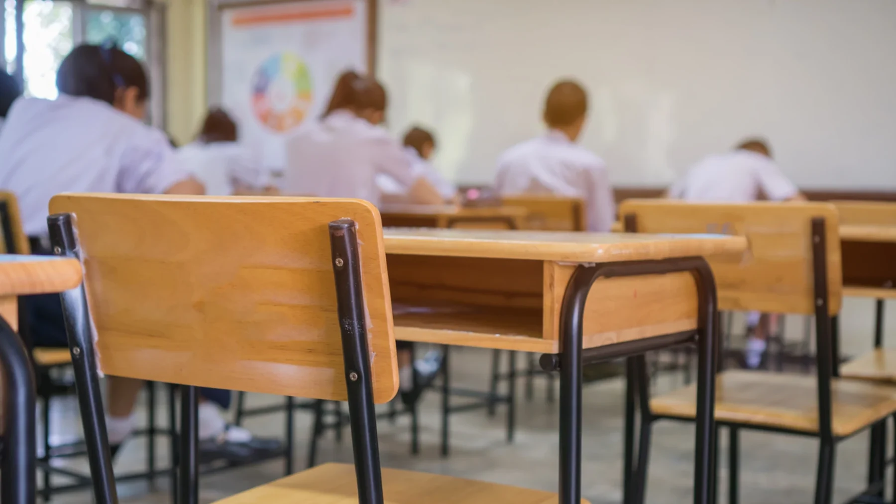 Students sitting at desks in a classroom in Mexico