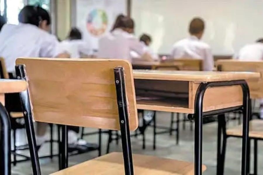 Students sitting at desks in a private school classroom in Chetumal, Quintana Roo