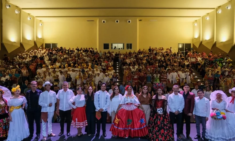 Students in traditional costumes performing on stage at the Cultural Encounter 2026 in Cancun
