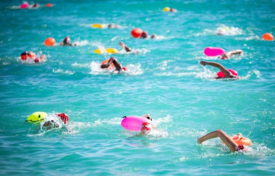 Swimmers competing in the Cancun-Isla Mujeres open water swimming event