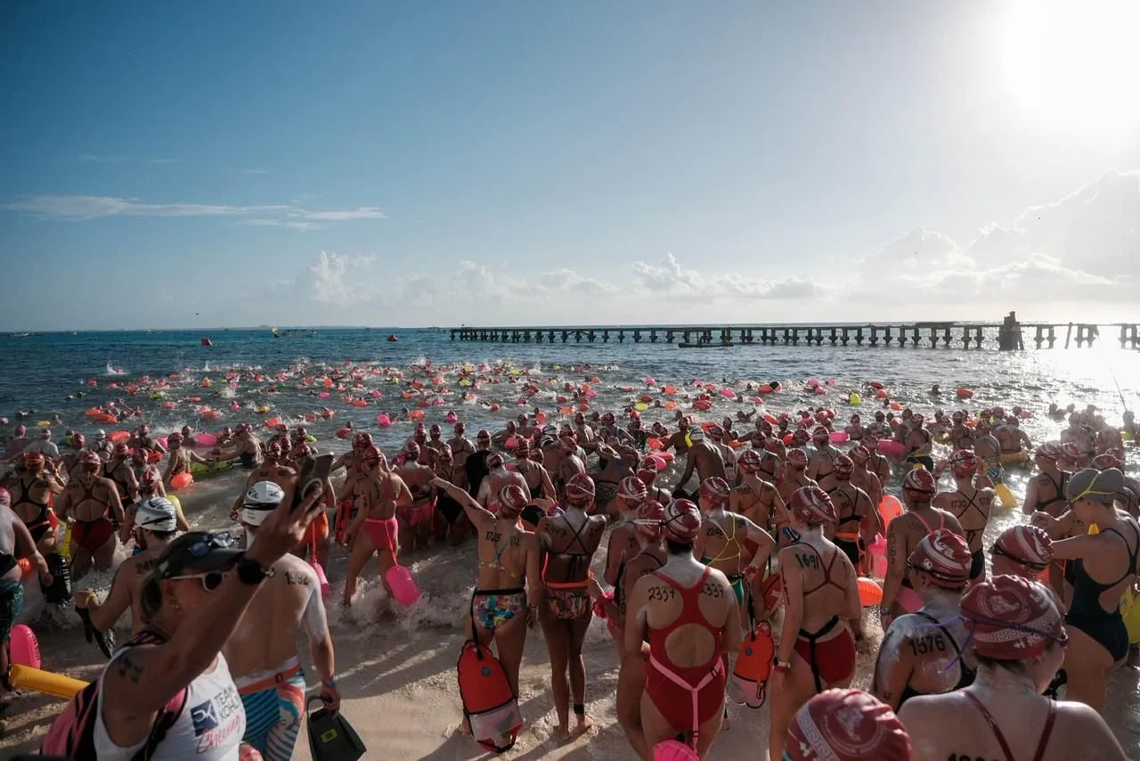Swimmers gather at Playa Caracol in Cancun for the start of the El Cruce open water swimming competition to Isla Mujeres