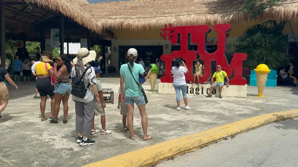 Certified tour guides standing near the entrance of the Tulum archaeological site in Quintana Roo, Mexico
