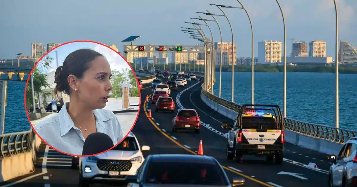 A traffic enforcement camera mounted on a pole overlooking a busy avenue in Cancun, Mexico