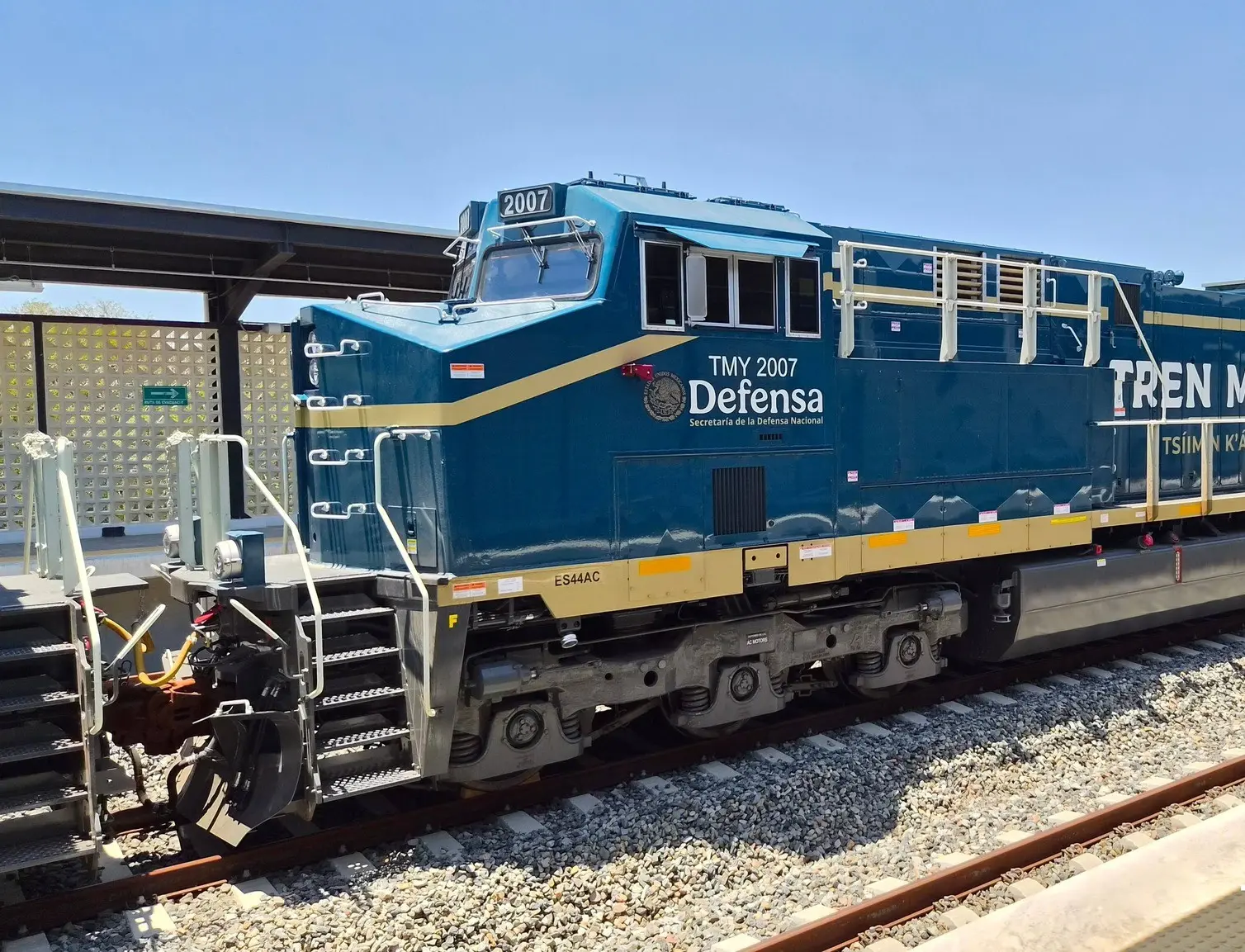 Two Tren Maya cargo locomotives parked at a station in Yucatan during testing