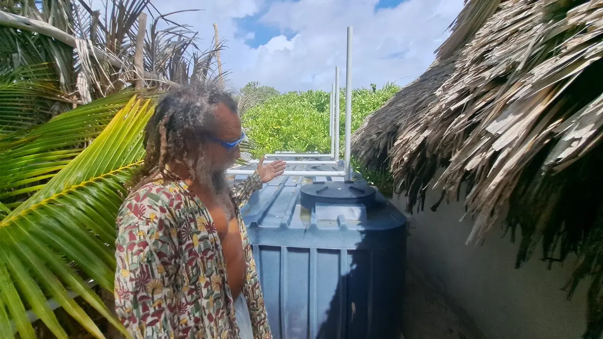 Businessman Cesar Ortiz standing next to an ecological wastewater treatment system in Tulum