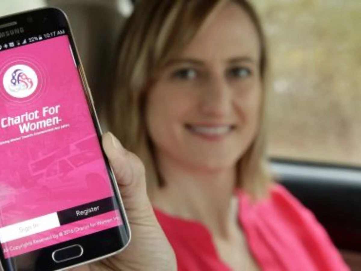 Smartphone showing Uber Women ride option in Cancun