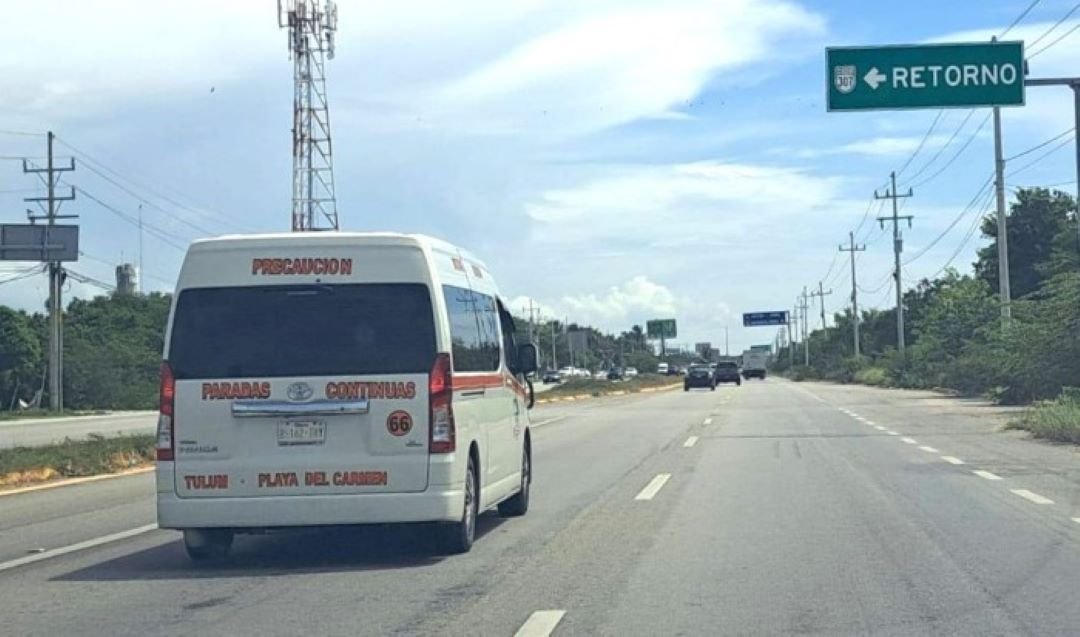 A white van from the Untrac transport union parked on a street in Tulum, Quintana Roo.