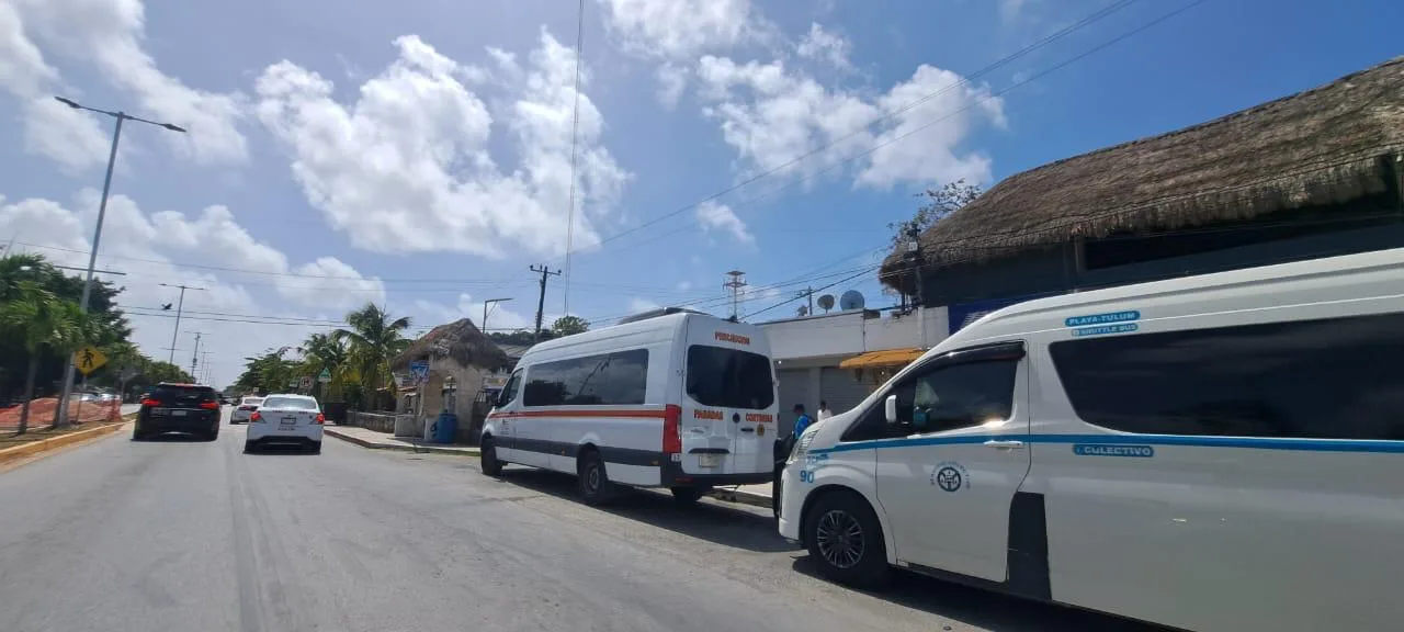 Vans parked along the Tulum-Playa del Carmen highway in Quintana Roo