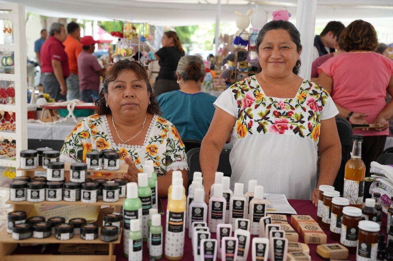 Artisans display embroidered garments and melipona honey at a fair in Yucatan, Mexico.