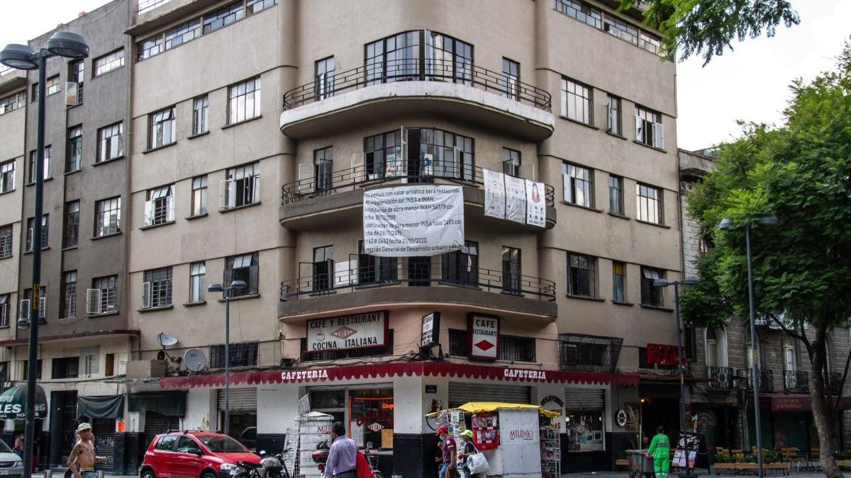 An Airbnb sign on a residential building in Mexico City, illustrating the platform's impact on housing availability.