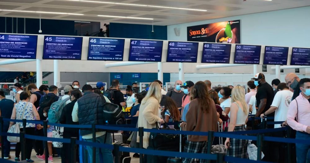Health officials screening passengers at an airport in Quintana Roo as a preventive measure against Ebola