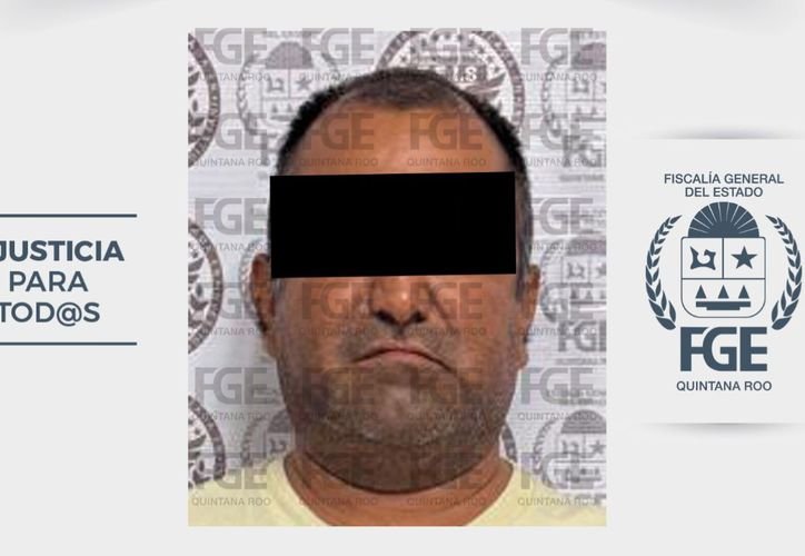 Anibal N. being led into a courthouse in Cancun for an extortion hearing