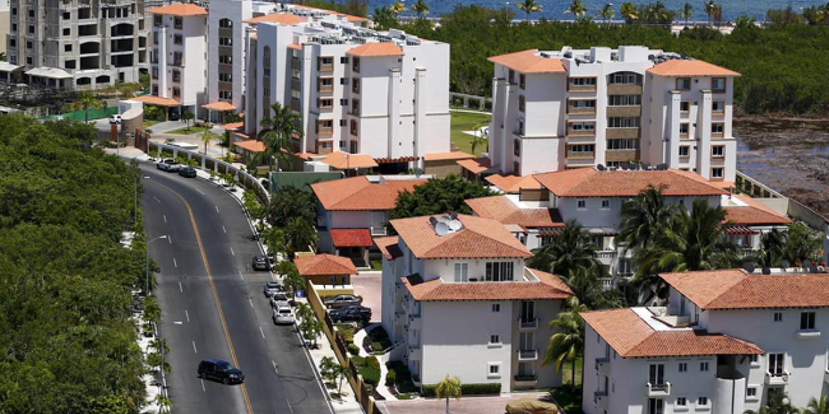 A row of modern apartment buildings in Cancun, Quintana Roo, representing vertical housing development in Mexico.