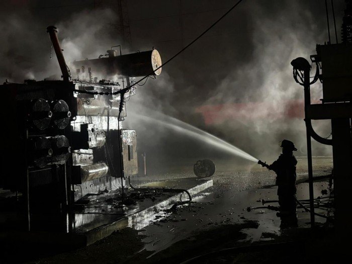 Firefighters and CFE personnel at the site of a substation fire in Cancun