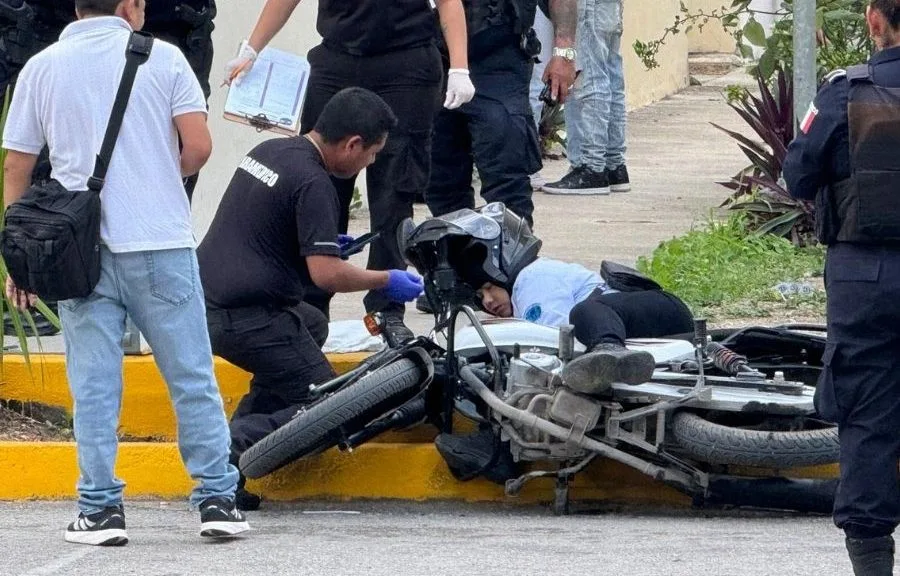 Police tape cordoning off a crime scene in a Cancun neighborhood