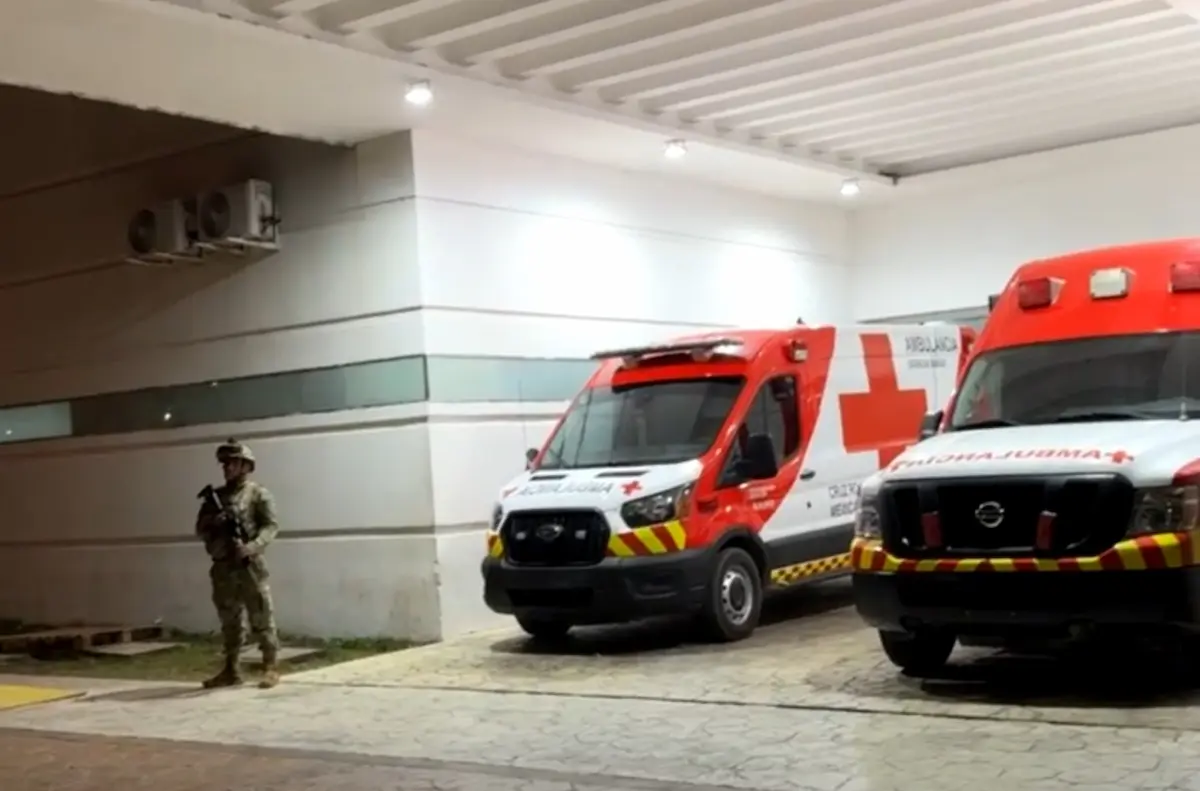 Police vehicles at a crime scene in Cancun after a shooting