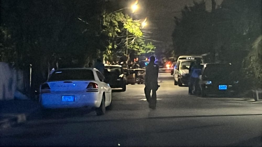 Police tape cordoning off a street in Cancun after a shooting