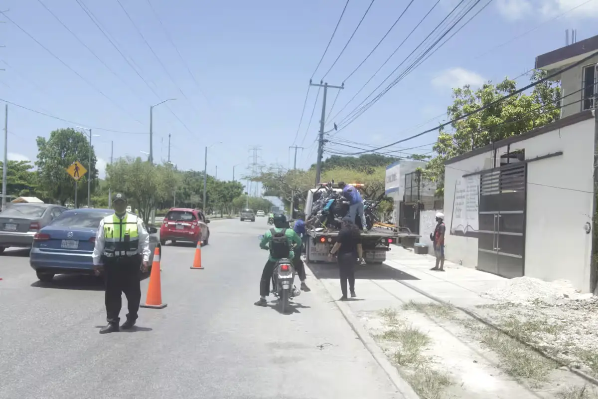 Traffic police officers inspect motorcycles during an operation on Avenida 20 de Noviembre in Cancun