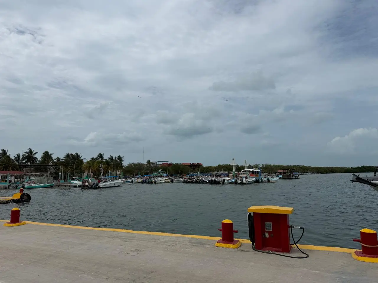Captain Carmelo, an 81-year-old fisherman, stands on his boat in Holbox, Quintana Roo.