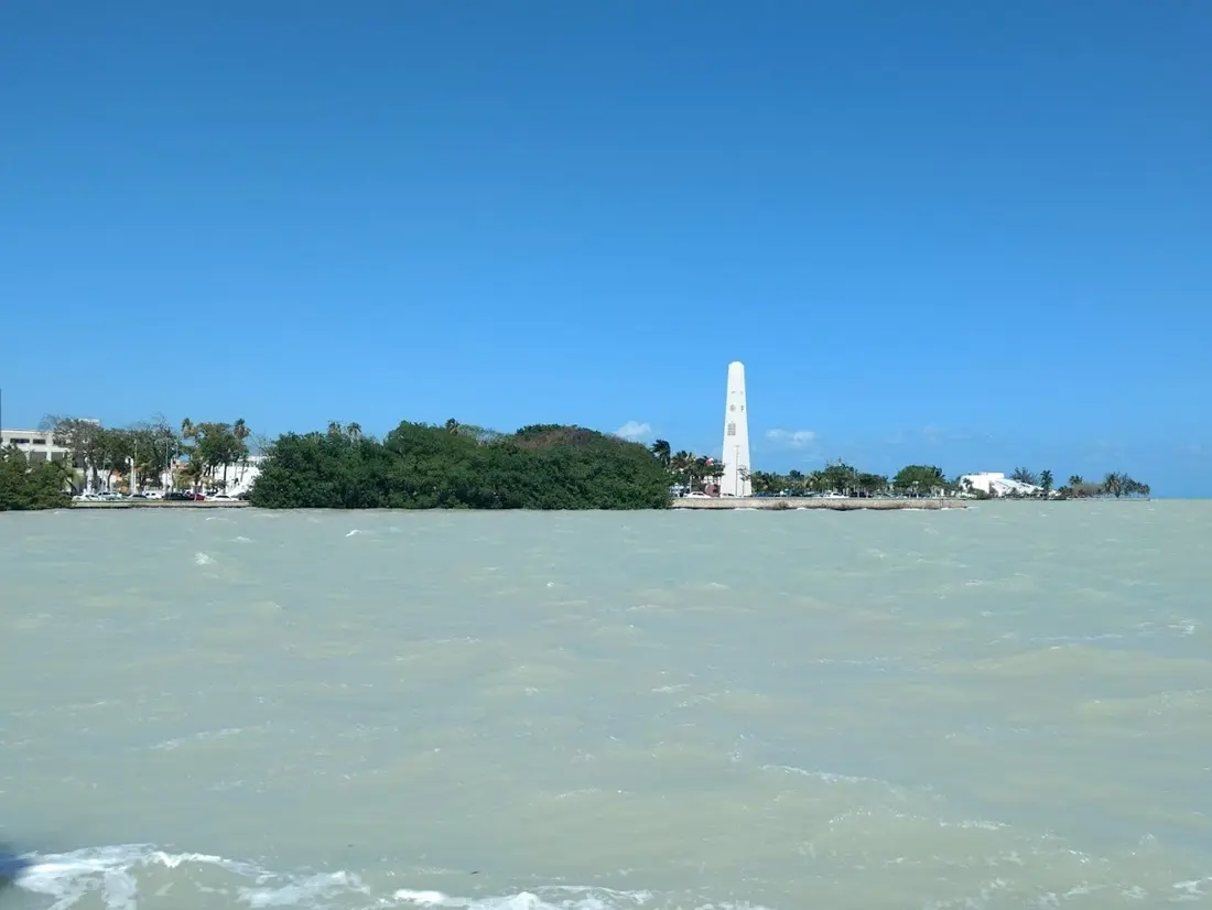 View of Chetumal Bay with murky water near agricultural fields