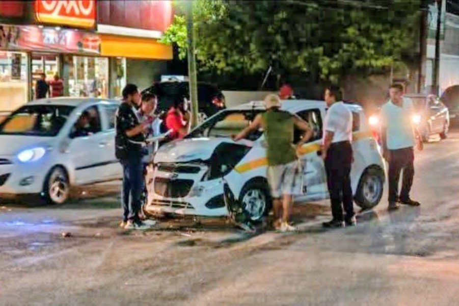 A damaged taxi at the scene of a collision with a pickup truck in Chetumal