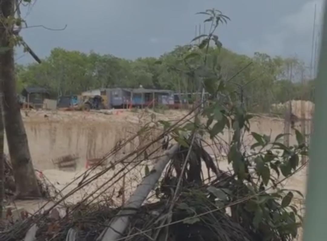 A cleared area of jungle with construction equipment visible in Playacar, Quintana Roo