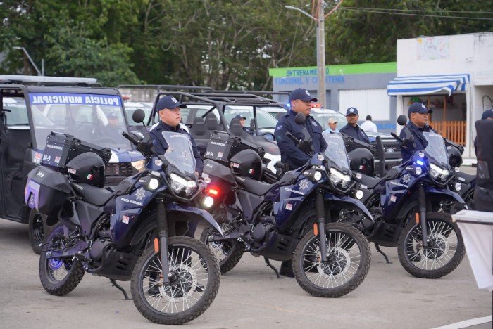 A police officer inspects a motorcycle during a traffic enforcement operation in Cozumel, Mexico.