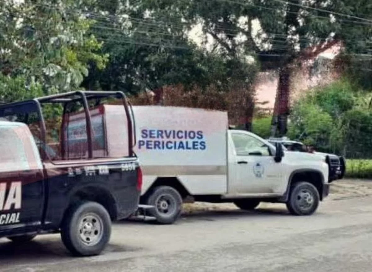 Police officers and forensic investigators at a crime scene on a farm in Francisco May, Isla Mujeres