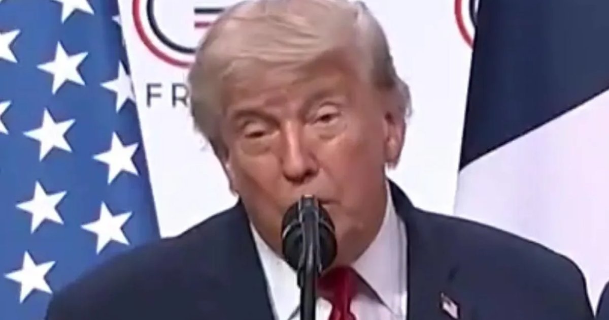 US President Donald Trump speaking at a podium during the G7 summit in Evian, France