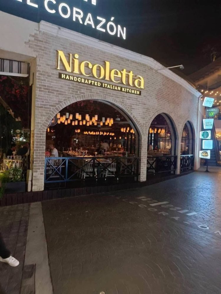 Nearly empty Quinta Avenida in Playa del Carmen with few pedestrians and open restaurants