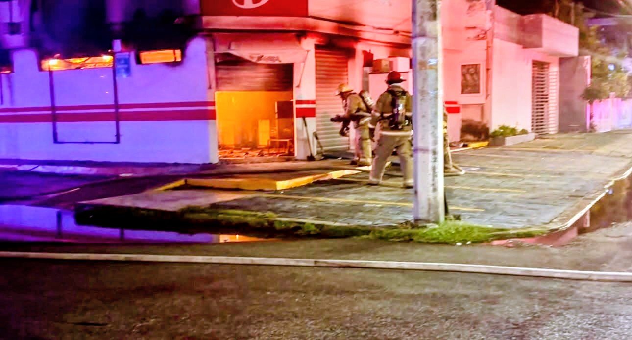 Firefighters working to extinguish a fire at a Dunosusa grocery store in Chetumal, Quintana Roo