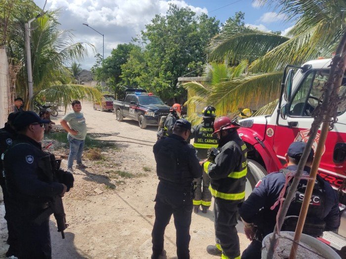 Firefighters extinguishing a fire at a palapa house in Playa del Carmen