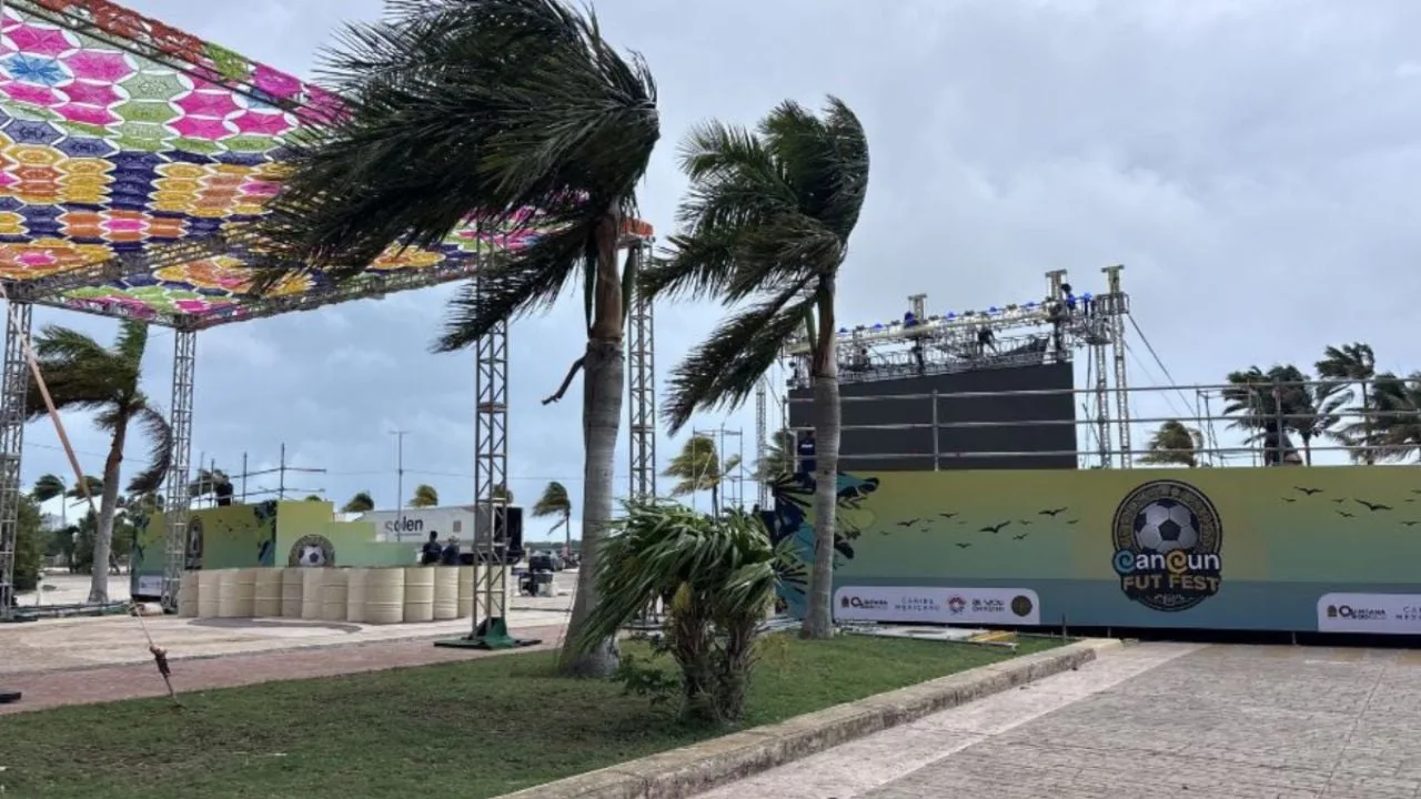 People watching a World Cup match on a giant screen at a public plaza in Cozumel