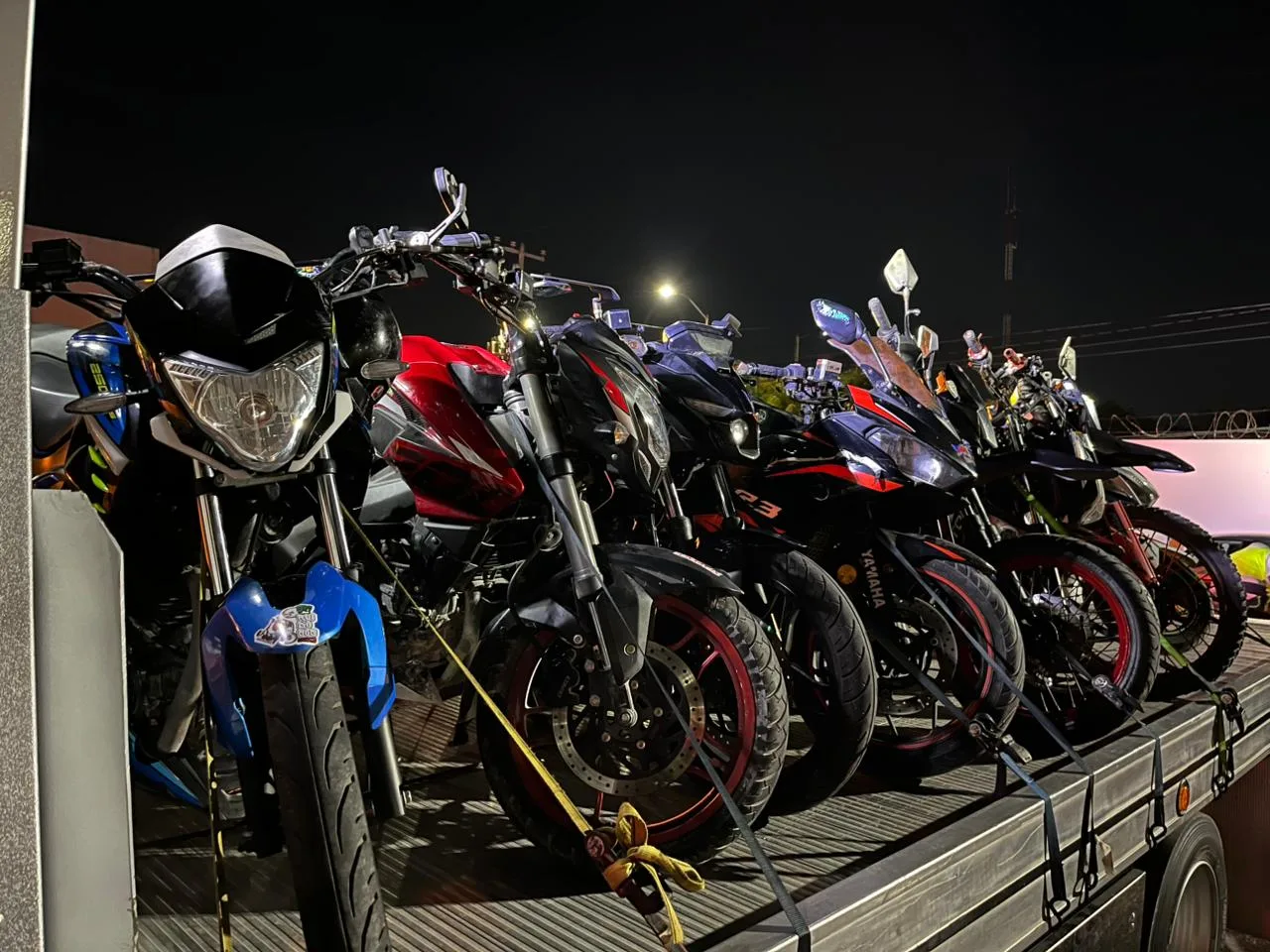 A group of motorcyclists riding on a street in Quintana Roo, Mexico