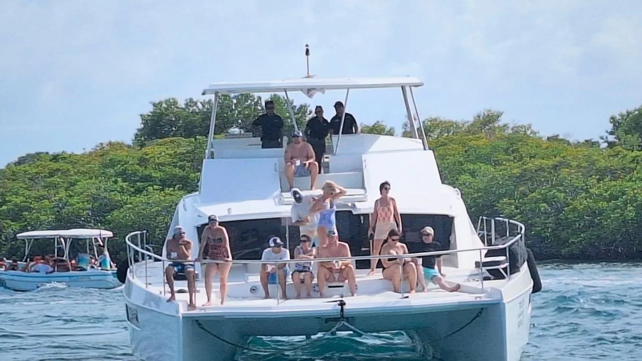 A yacht anchored in the turquoise waters of the Cancun marine park