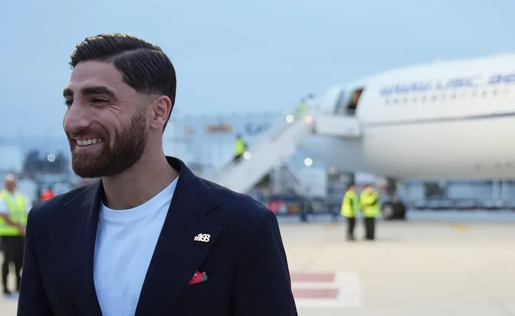 Iranian soccer player Alireza Jahanbakhsh smiling as he arrives for the 2026 World Cup in Tijuana, Mexico