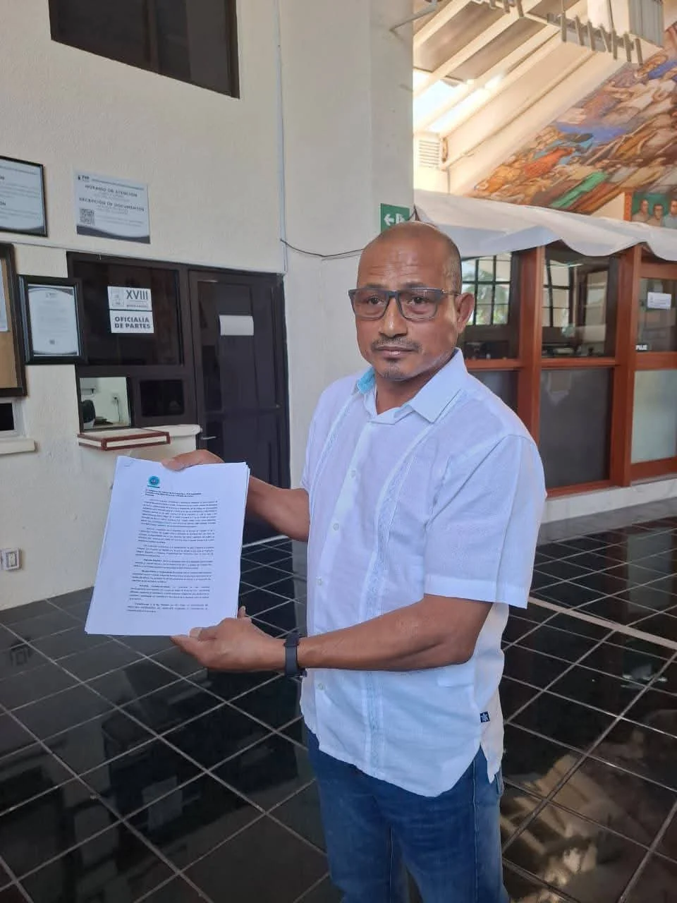 Journalists from the Union of Journalists and Digital Media of Quintana Roo hand over a proposed law to the state Congress in Chetumal.