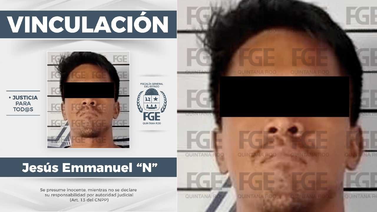 A man in handcuffs being led by police officers in Cancun
