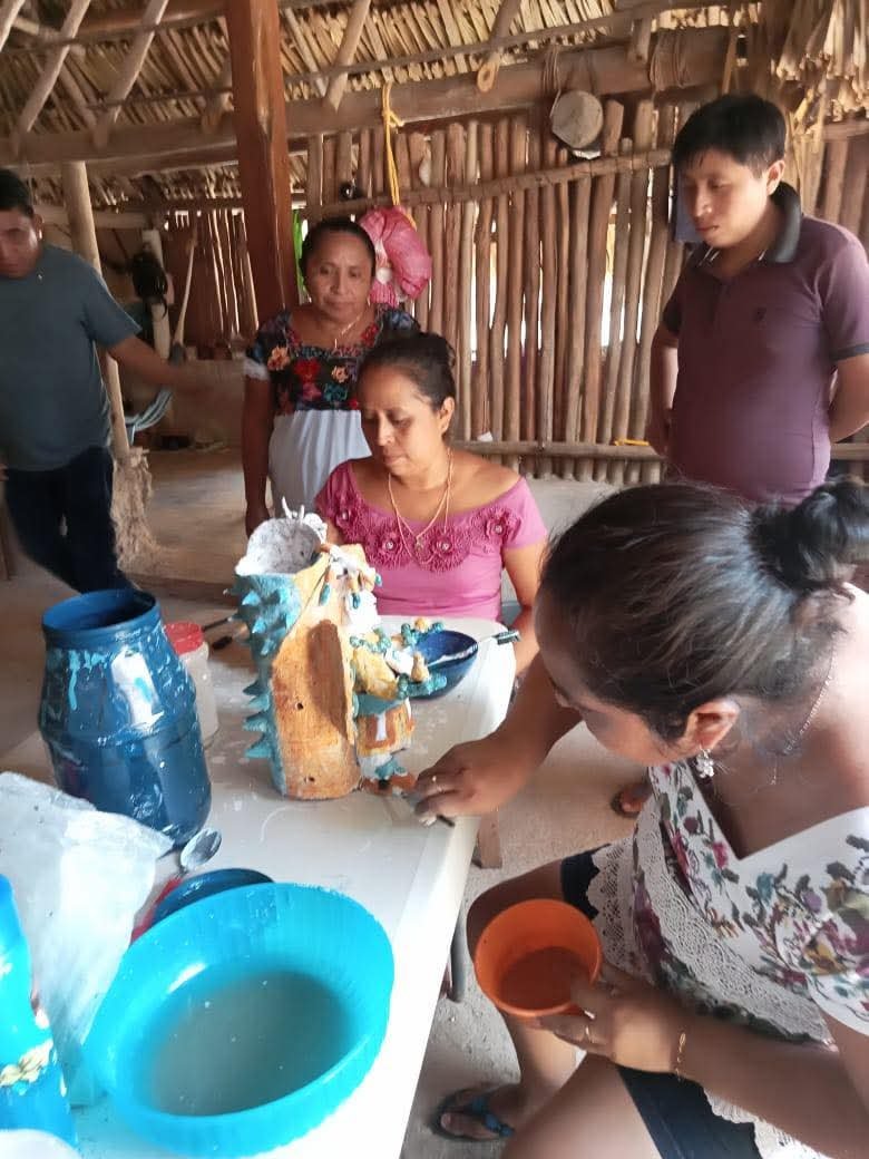 Hand-painted Maya-style ceramic vessels on display