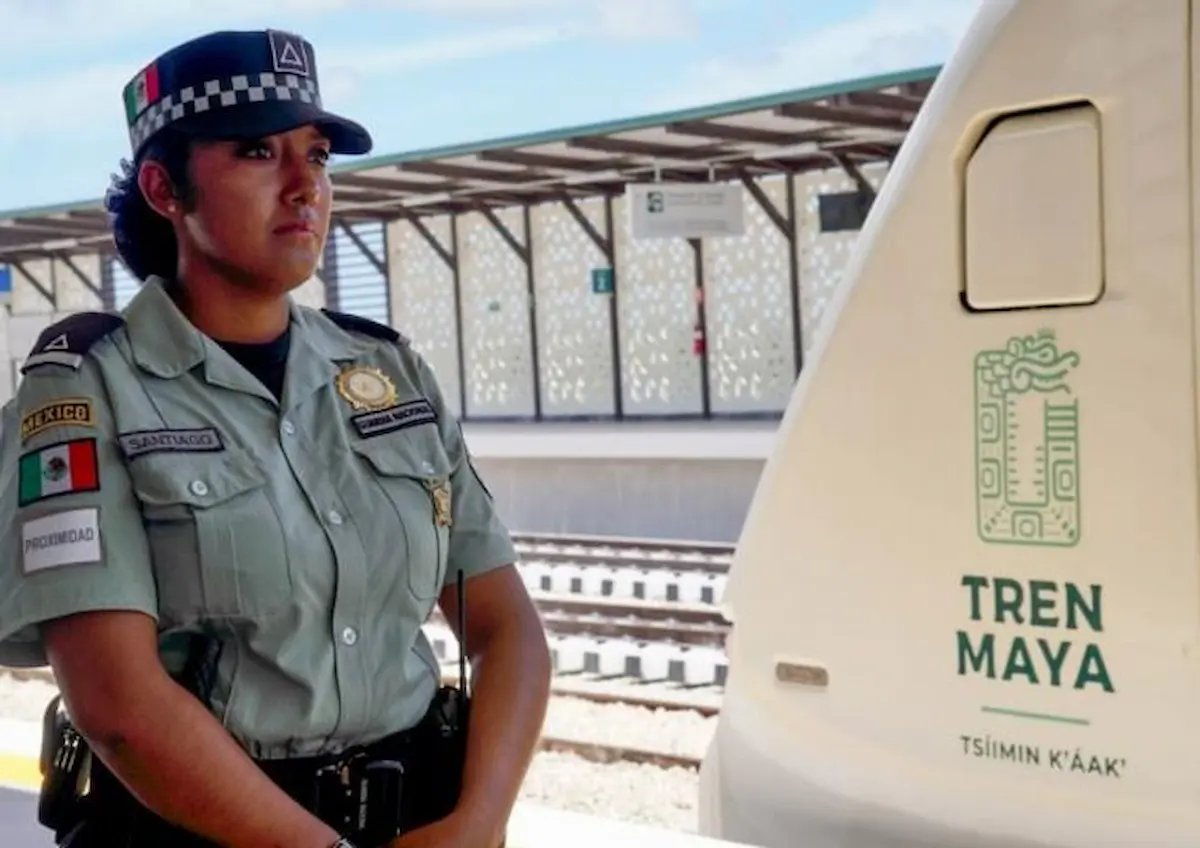 A Maya Train station with military personnel and passengers