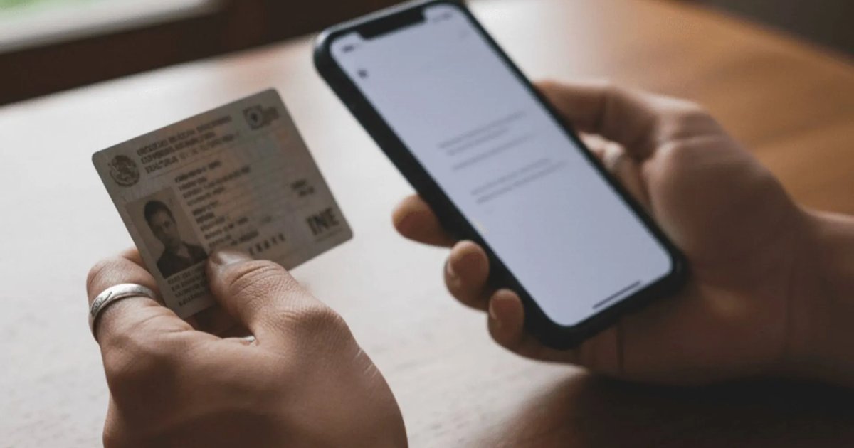 A person holding a smartphone with a blurred background of legal documents