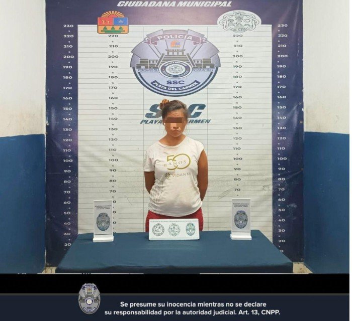 Police officers in Playa del Carmen detain a woman accused of attempting to sell a minor