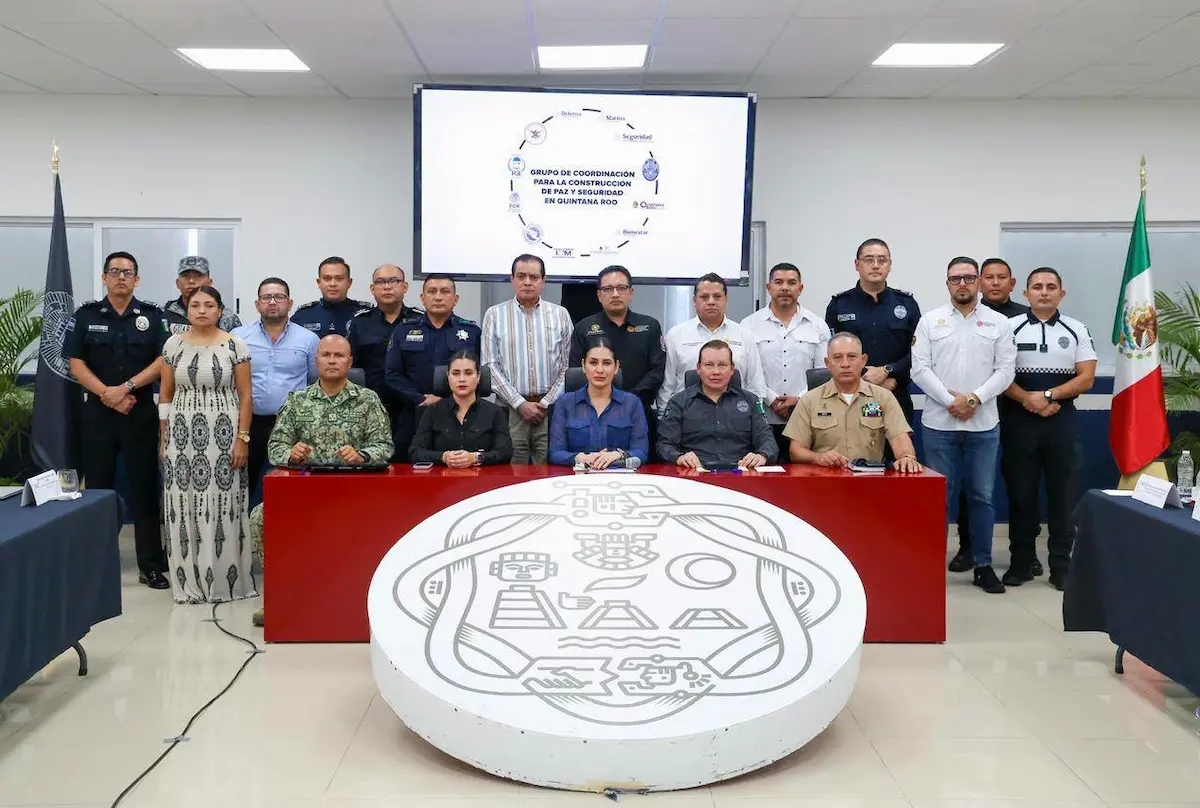 Security officials gathered around a table during a meeting in Playa del Carmen