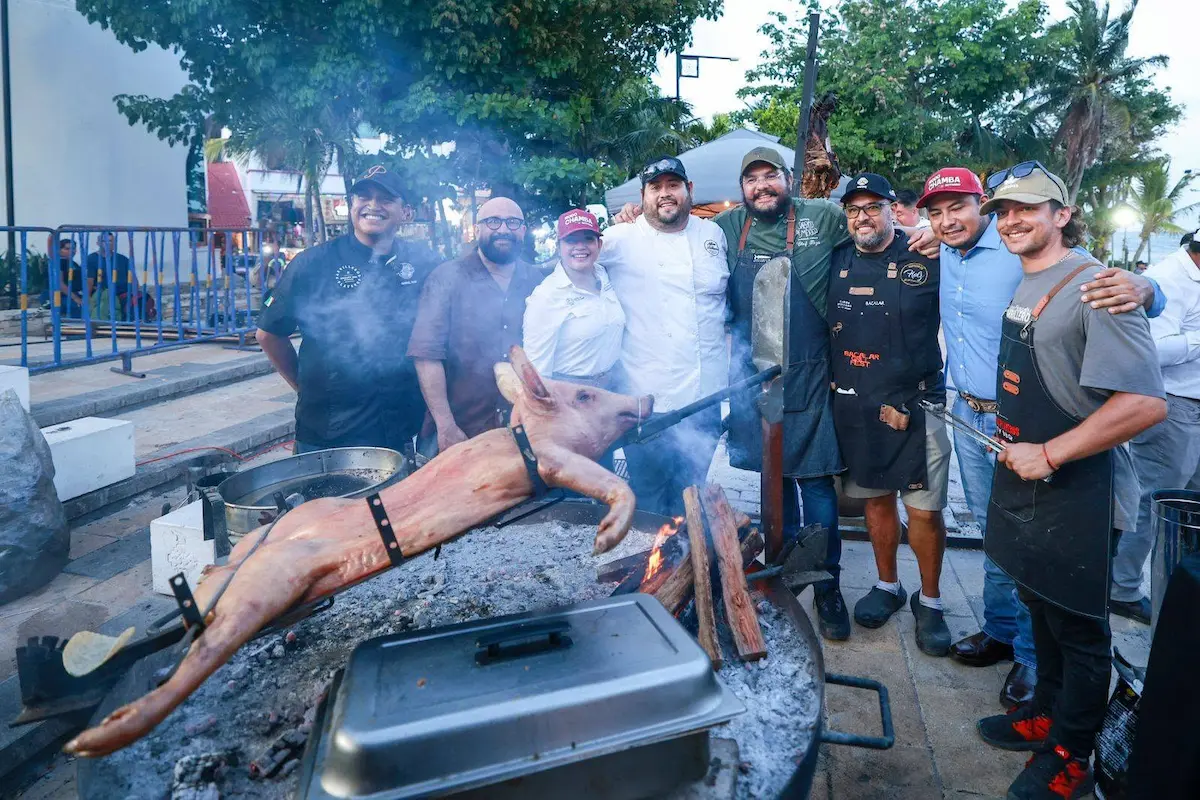Crowd at Playa Grill Fest with grills and food stalls at Portal Maya in Playa del Carmen