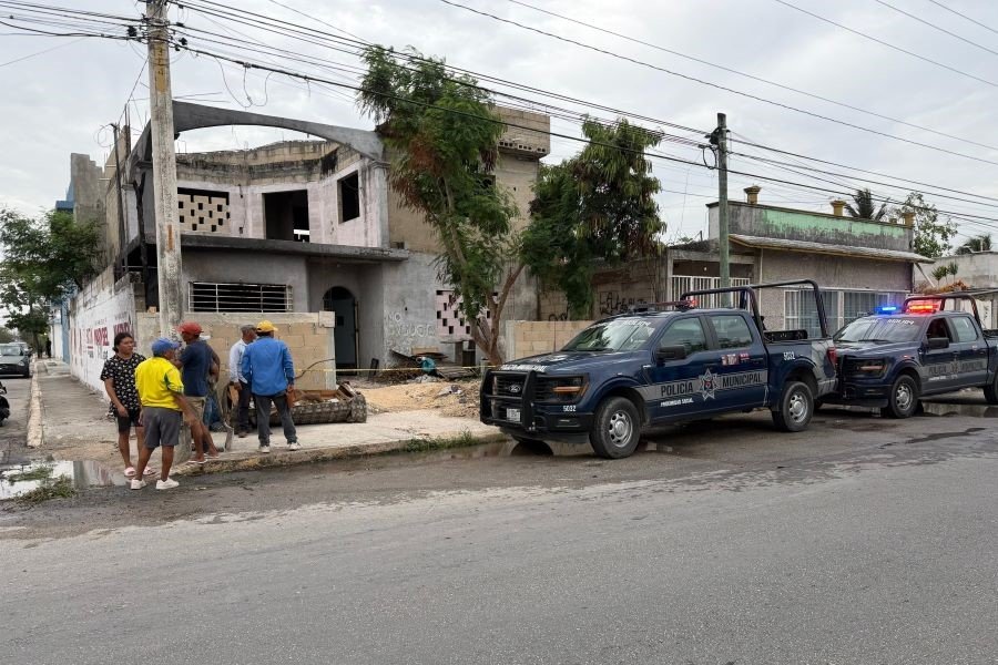 Police cordon off a home in Cancun where human remains were discovered in a septic tank during renovation work
