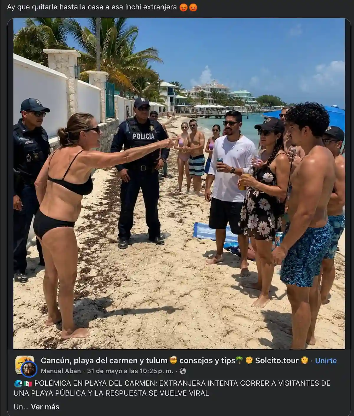 People holding signs on a beach demanding free access to public beaches in Quintana Roo, Mexico