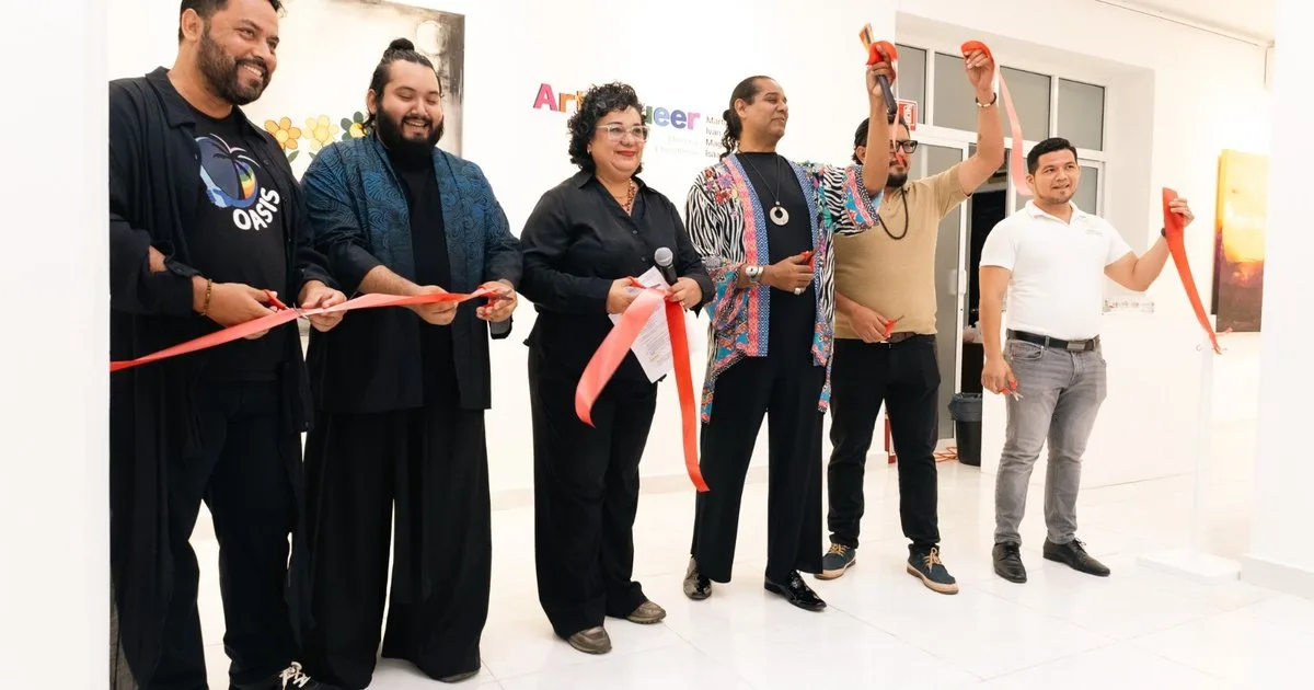 Visitors viewing the Queer: Art, Memory and Resistance exhibition at the Art Gallery in Playa del Carmen