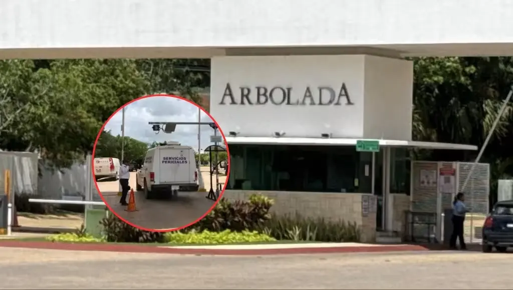 Exterior view of a white and blue house at Enebro 1 in Residencial Arbolada, Cancun, where a man was found dead.